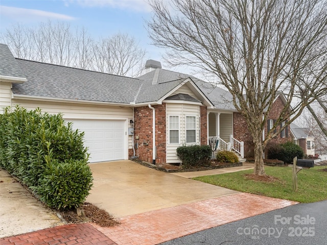 view of front of home featuring a garage and a front lawn