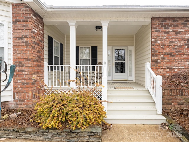 property entrance featuring covered porch