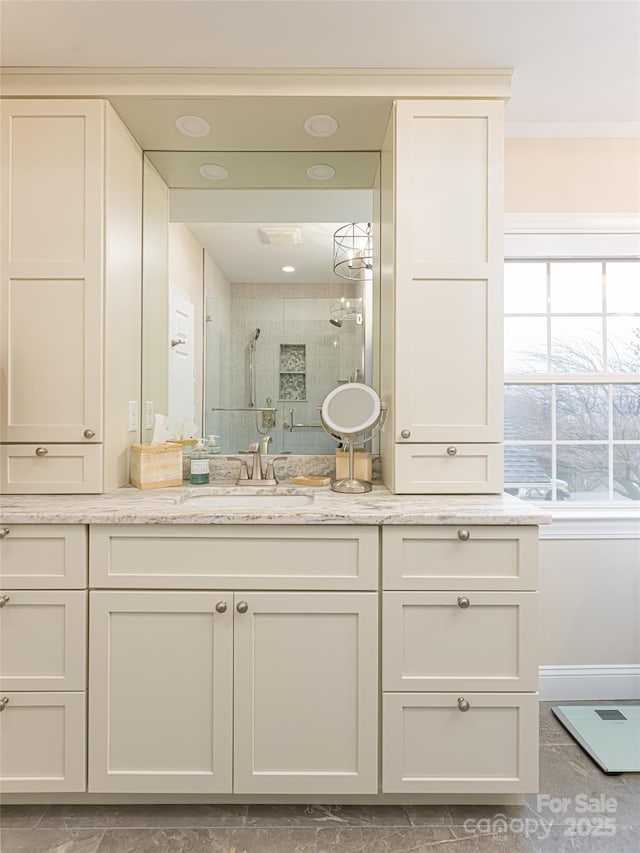 bathroom with vanity and an enclosed shower