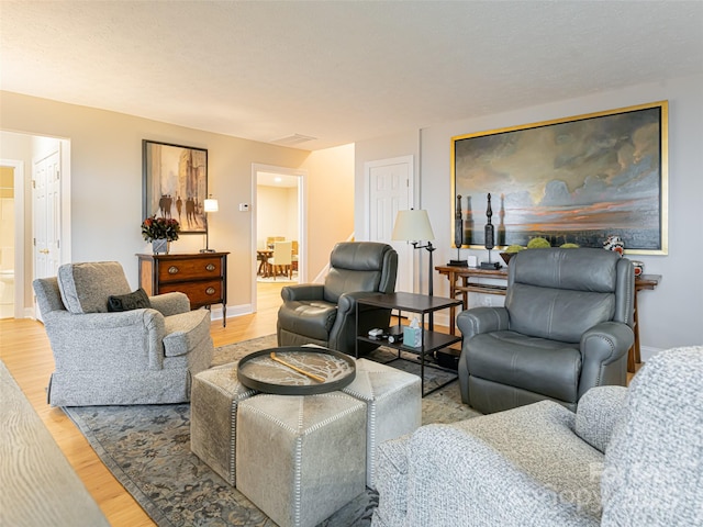 living room with light hardwood / wood-style floors