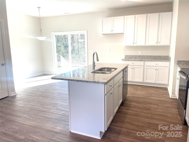 kitchen with white cabinets, pendant lighting, and sink