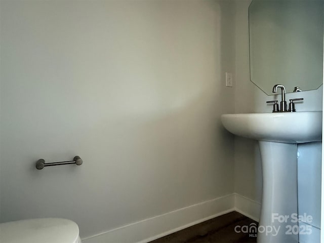 bathroom with toilet and sink