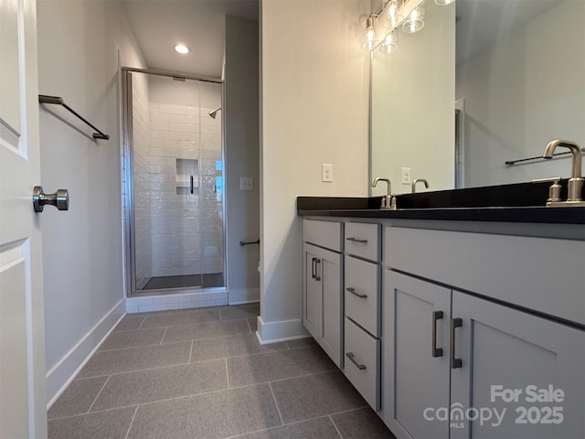 bathroom with vanity, tile patterned floors, and walk in shower