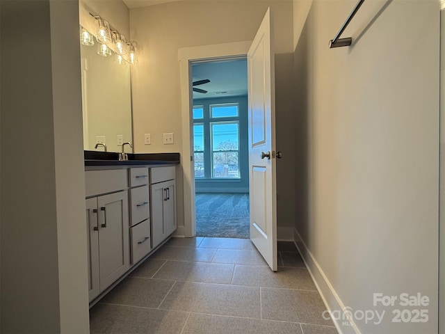 bathroom with tile patterned flooring and vanity