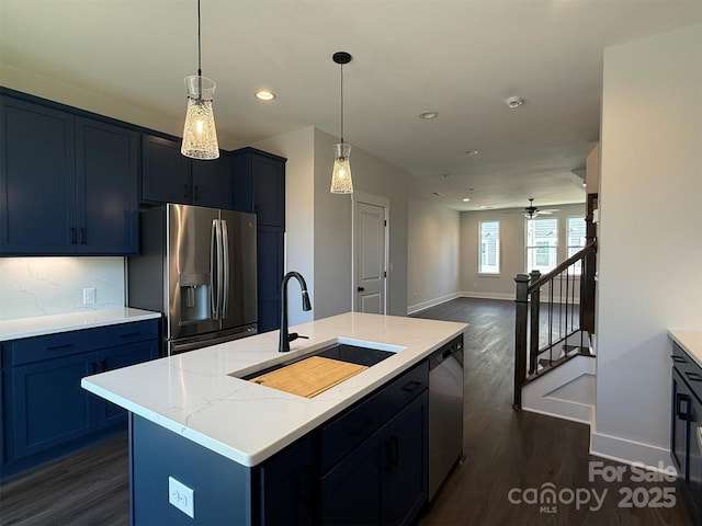 kitchen with dark wood finished floors, recessed lighting, appliances with stainless steel finishes, and a sink