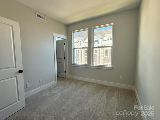 interior space featuring baseboards and visible vents