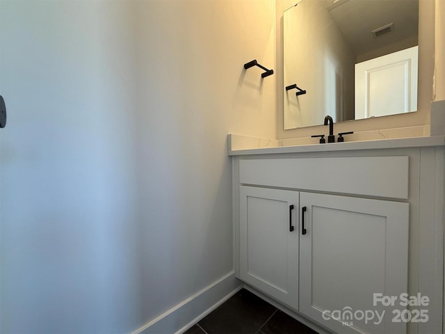 bathroom with tile patterned floors and vanity