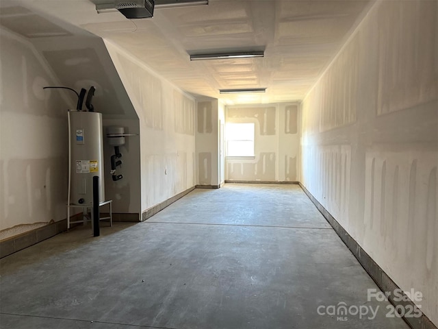 interior space featuring water heater and a garage door opener