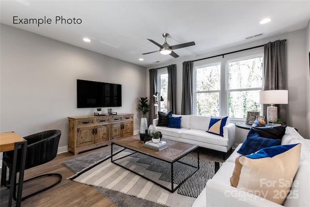 living area featuring visible vents, wood finished floors, recessed lighting, baseboards, and ceiling fan