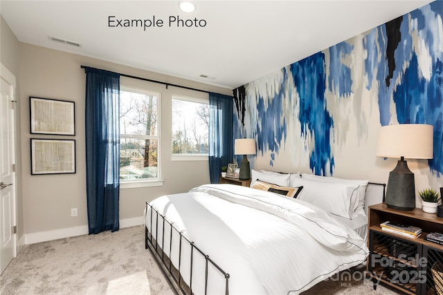 bedroom with visible vents, baseboards, and carpet