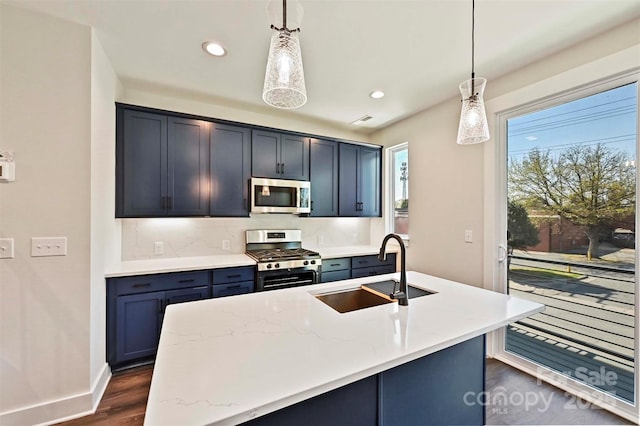 1227 E 34th St Unit Csw0420, Charlotte, NC 28205 - kitchen with appliances with stainless steel finishes, a sink, dark wood-type flooring, decorative backsplash, and recessed lighting