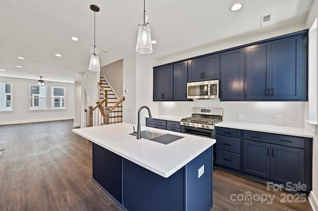 1227 E 34th St Unit Csw0420, Charlotte, NC 28205 - kitchen with a sink, stainless steel appliances, dark wood-style flooring, decorative backsplash, and a ceiling fan