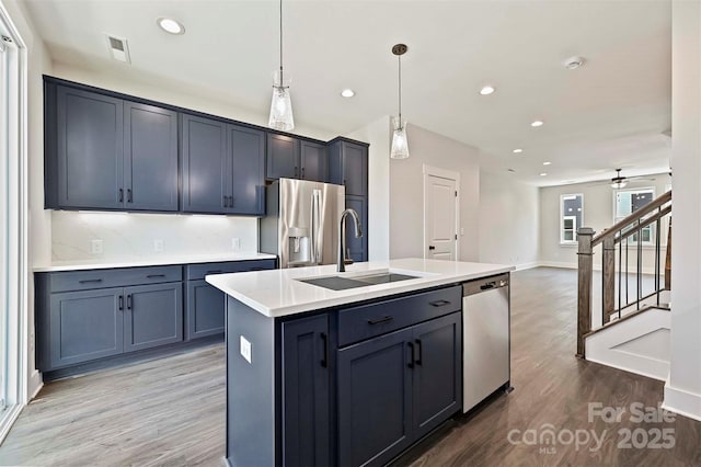 1227 E 34th St Unit Csw0420, Charlotte, NC 28205 - kitchen featuring a sink, stainless steel appliances, light wood-type flooring, light countertops, and recessed lighting