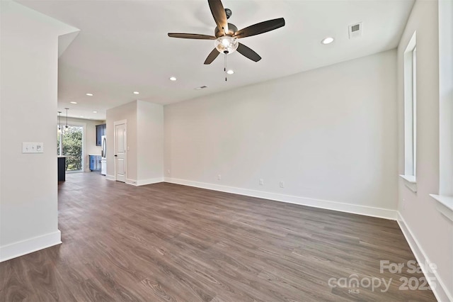 1227 E 34th St Unit Csw0420, Charlotte, NC 28205 - unfurnished room with a ceiling fan, baseboards, dark wood-style flooring, and recessed lighting