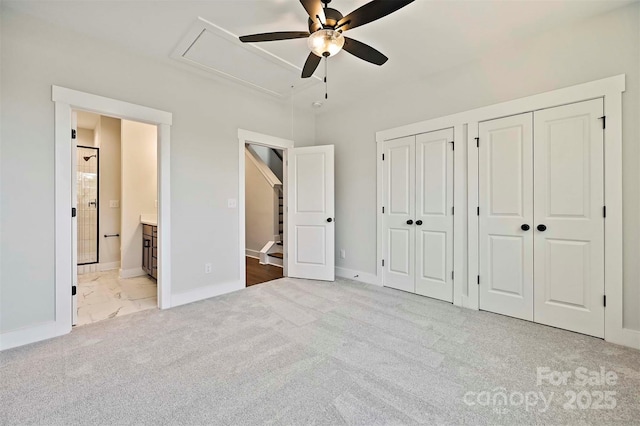 1227 E 34th St Unit Csw0420, Charlotte, NC 28205 - unfurnished bedroom with attic access, multiple closets, carpet flooring, connected bathroom, and baseboards