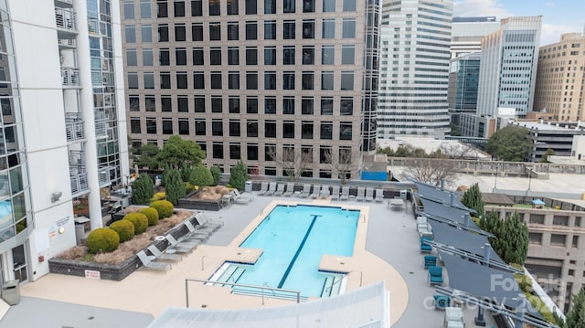 view of swimming pool featuring a patio area