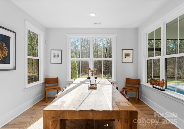 dining space with light hardwood / wood-style floors