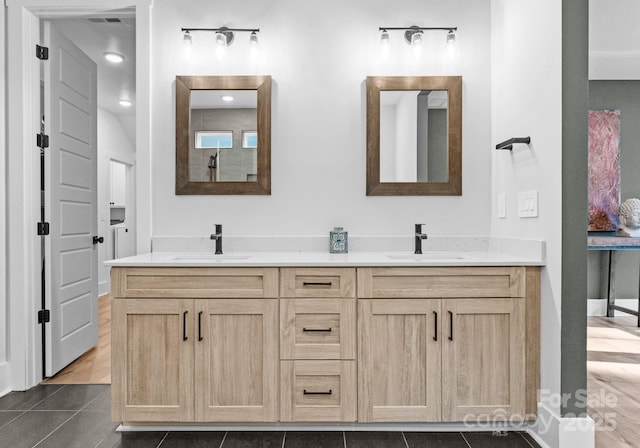 bathroom with tile patterned floors and vanity