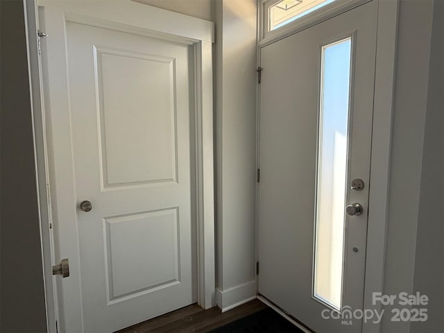 doorway to outside featuring dark hardwood / wood-style flooring