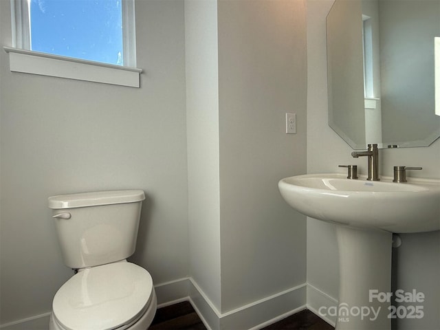 bathroom featuring sink and toilet