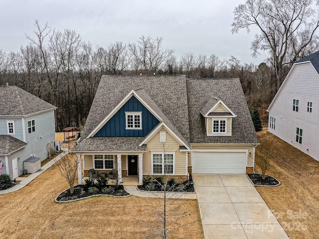 view of front of property with a garage and a front yard