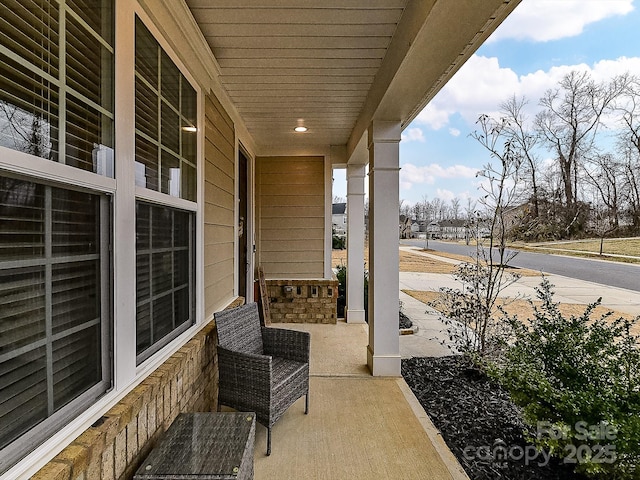 view of patio featuring a porch