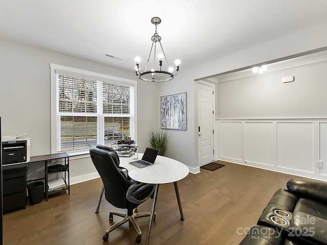 office with a chandelier and dark wood-type flooring