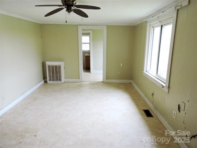 unfurnished room featuring ceiling fan