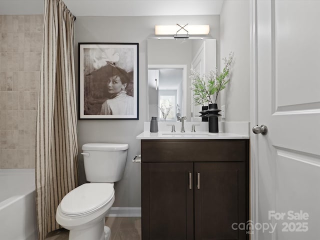 full bath featuring toilet, baseboards, shower / bath combination with curtain, and vanity