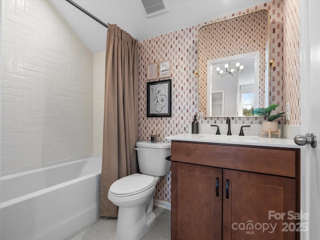 bathroom featuring vanity, visible vents, toilet, tile patterned floors, and a notable chandelier