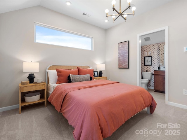 bedroom with visible vents, baseboards, a chandelier, light colored carpet, and ensuite bathroom