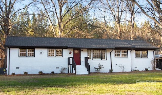 ranch-style home featuring a front yard