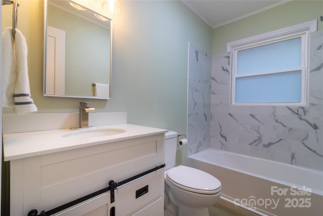 full bathroom with tiled shower / bath, toilet, vanity, and ornamental molding