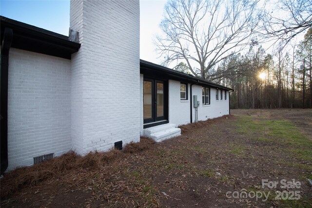 view of property exterior at dusk