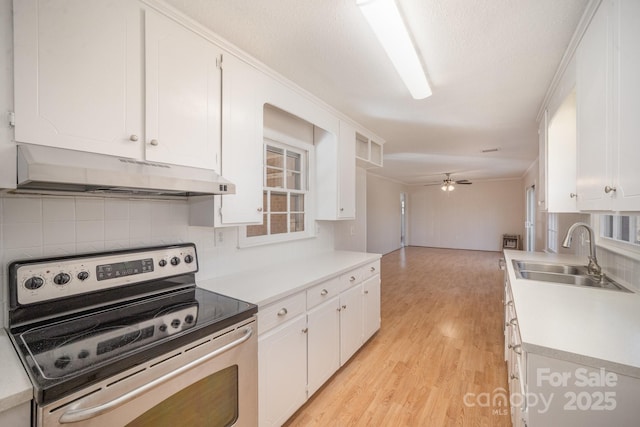 kitchen featuring tasteful backsplash, ceiling fan, sink, electric stove, and white cabinetry