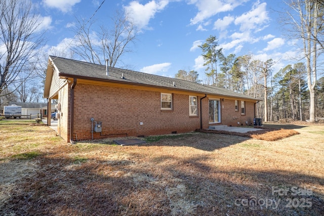 rear view of property featuring a lawn