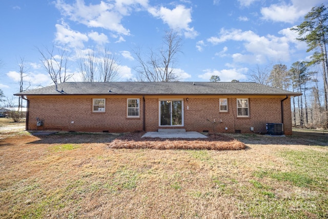 back of property featuring a yard and central AC