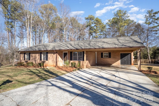 ranch-style home featuring a front yard and a carport