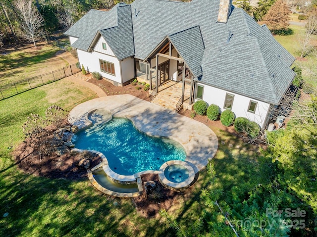 view of swimming pool with a yard, a patio, and an in ground hot tub