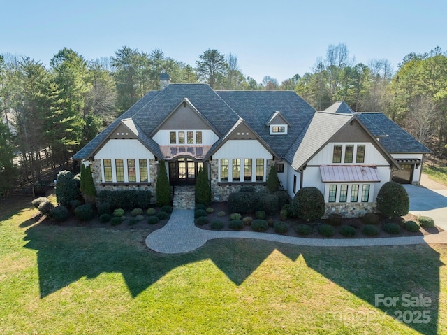 view of front of house with a garage and a front yard