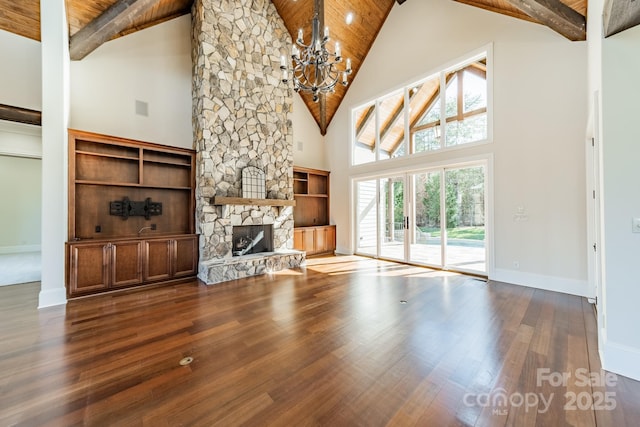 unfurnished living room featuring wood ceiling, a fireplace, and hardwood / wood-style flooring