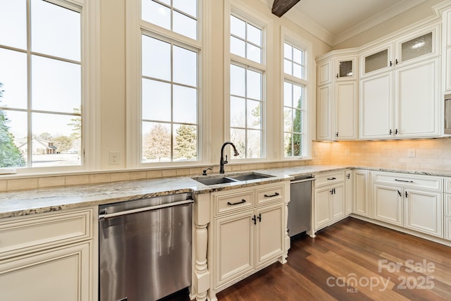 kitchen with sink, stainless steel dishwasher, ornamental molding, light stone countertops, and decorative backsplash