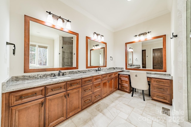 bathroom featuring vanity, ornamental molding, and an enclosed shower