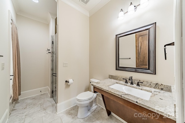 bathroom with crown molding, vanity, toilet, and a shower