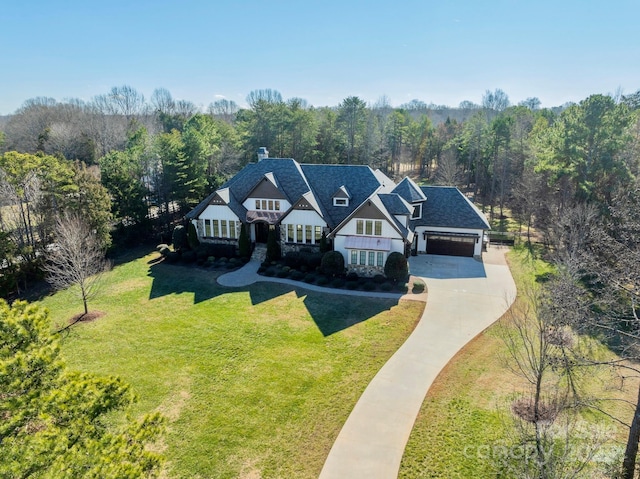 view of front facade with a garage and a front lawn