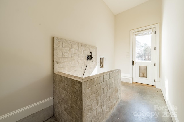 bar featuring concrete flooring