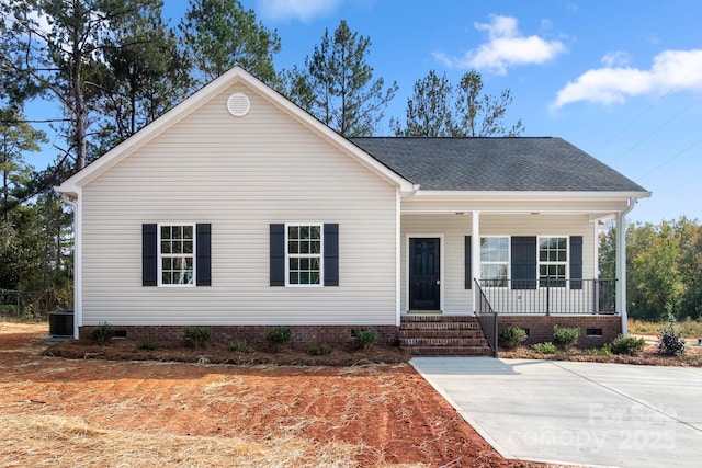 view of front of property with crawl space, covered porch, and roof with shingles