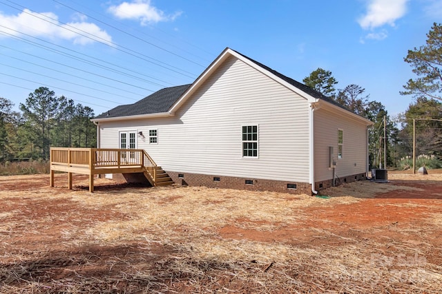 back of house with crawl space, central AC, and a deck