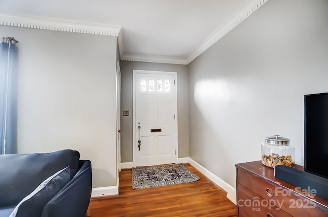 entryway with crown molding and hardwood / wood-style flooring