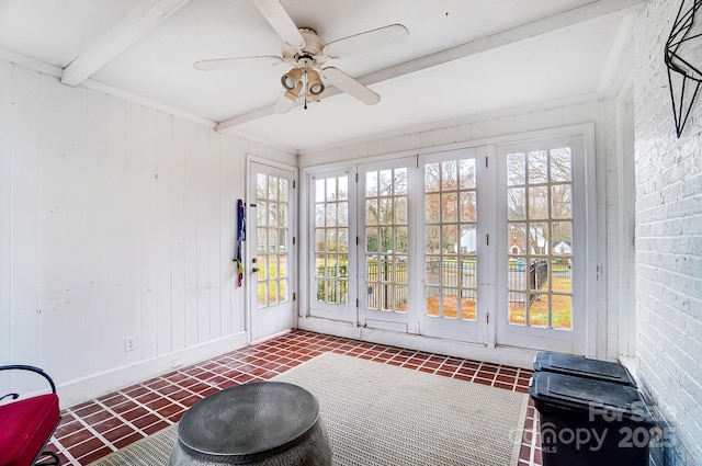 sunroom with beam ceiling and ceiling fan